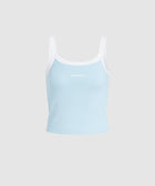 Light blue tank top with white straps on a light gray background